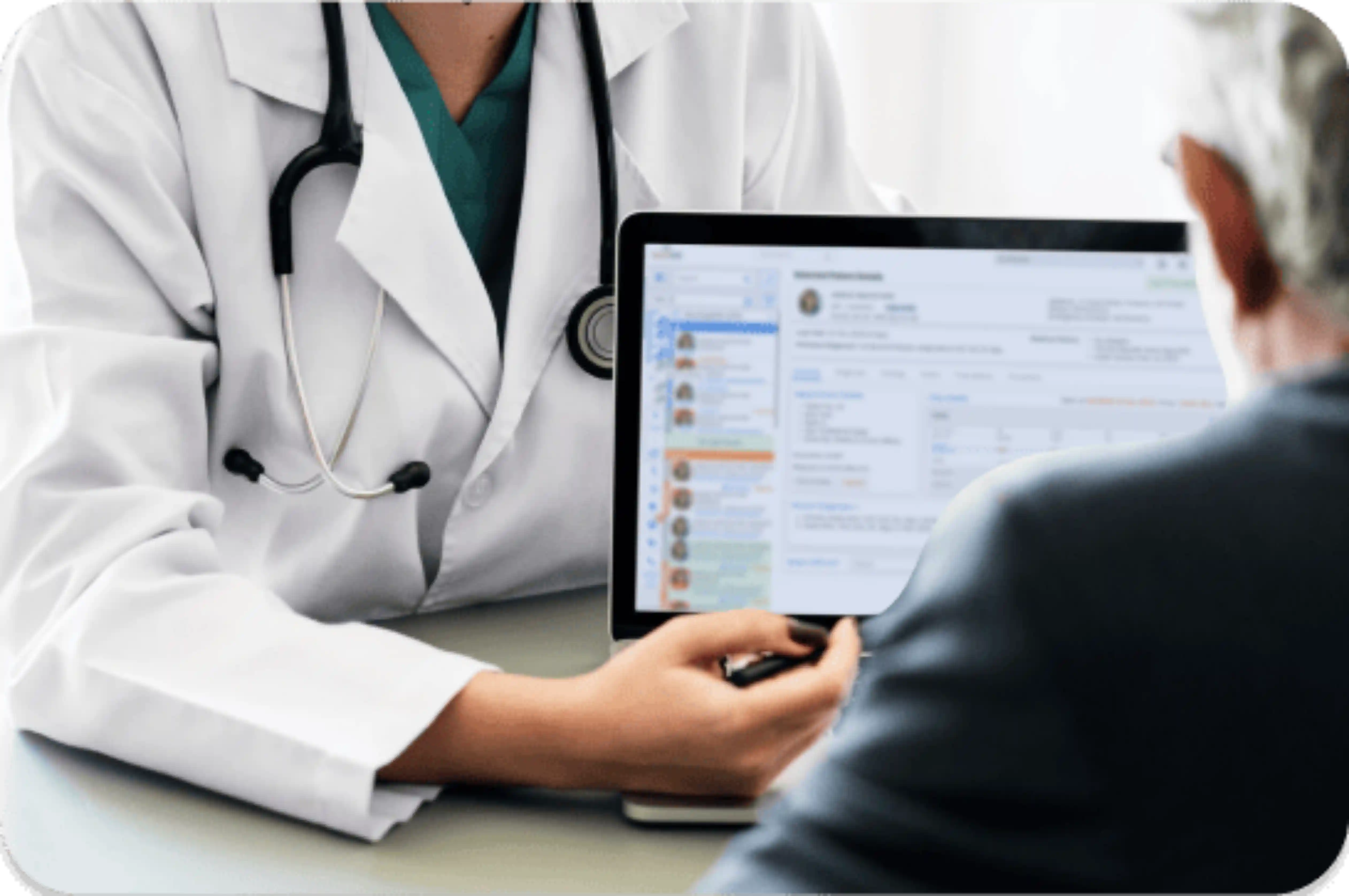 A doctor in a white coat is showing a patient medical records on a laptop screen, showcasing the efficiency of the paperless hospital management system. The doctor holds the laptop and points at the screen, while the patient listens.