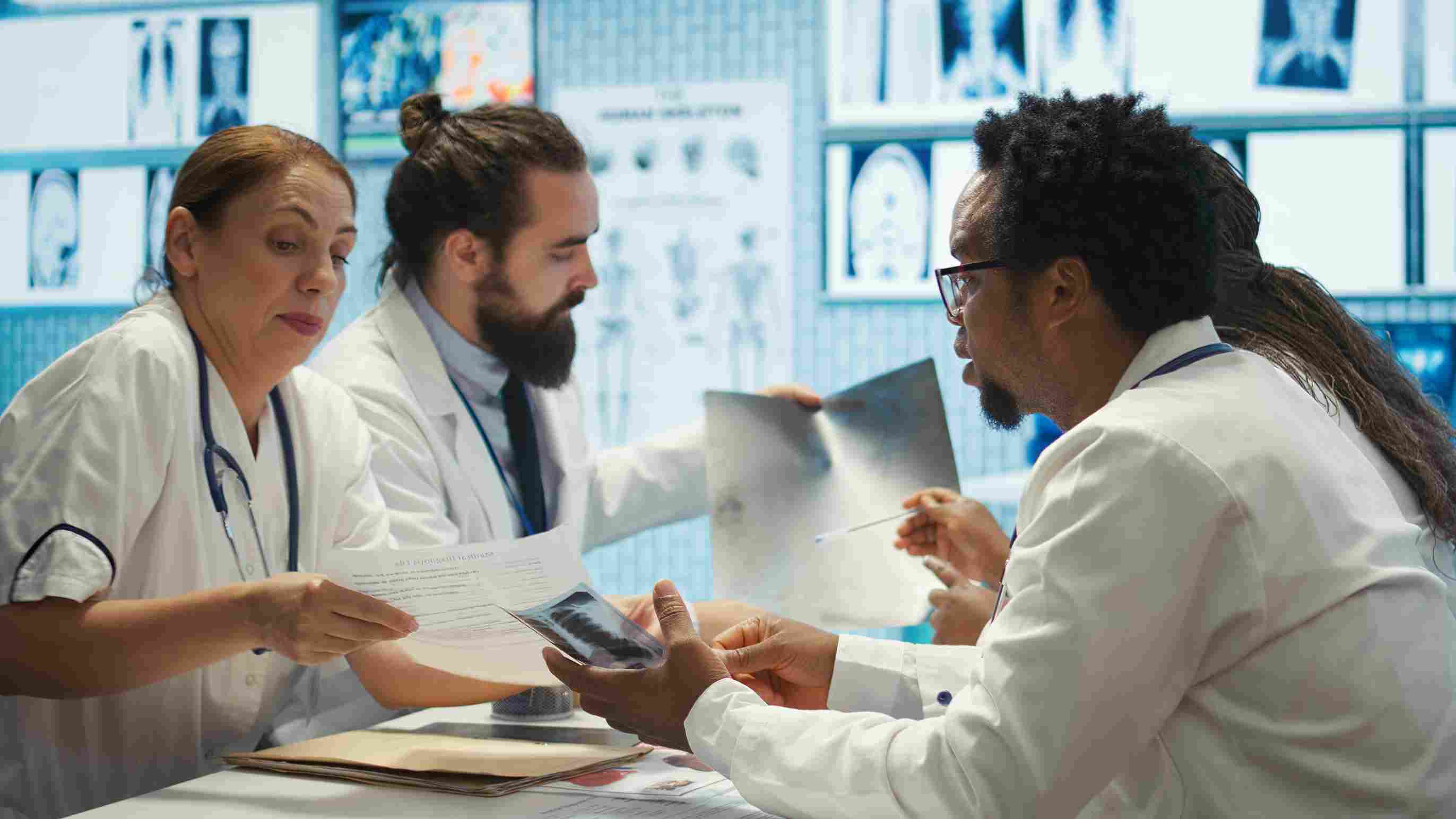 Medical team collaborating and reviewing diagnostic images in a hospital.