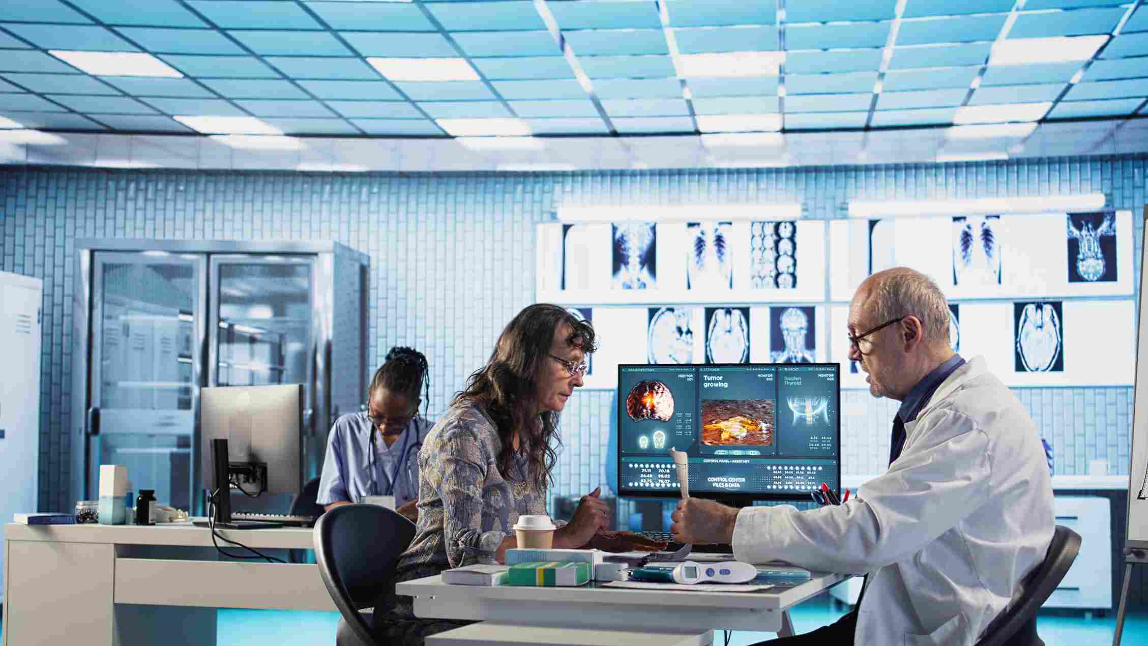 Doctor showing diagnostic report on hospital management software to patient