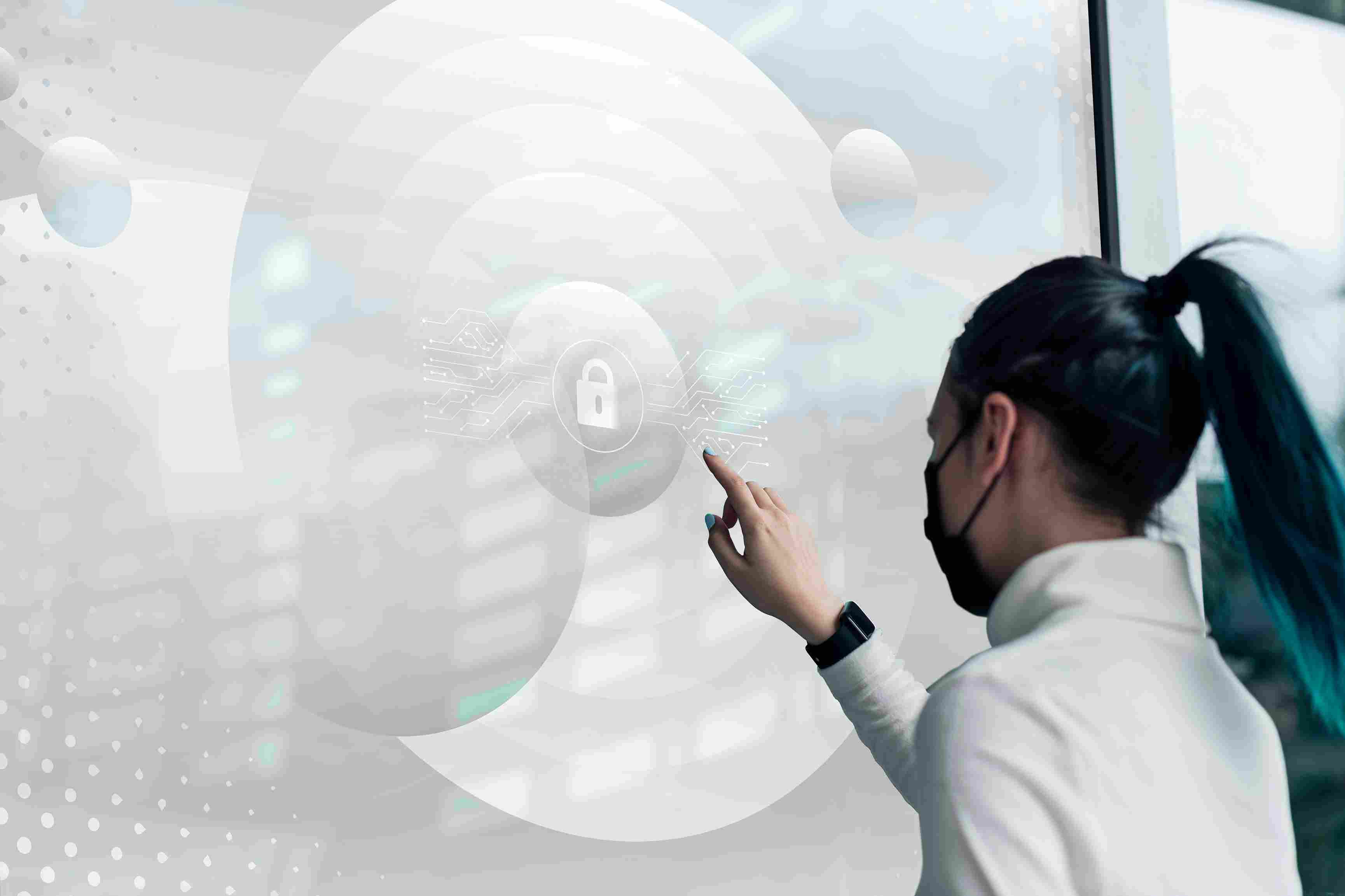 Woman using futuristic digital banking interface on a transparent screen