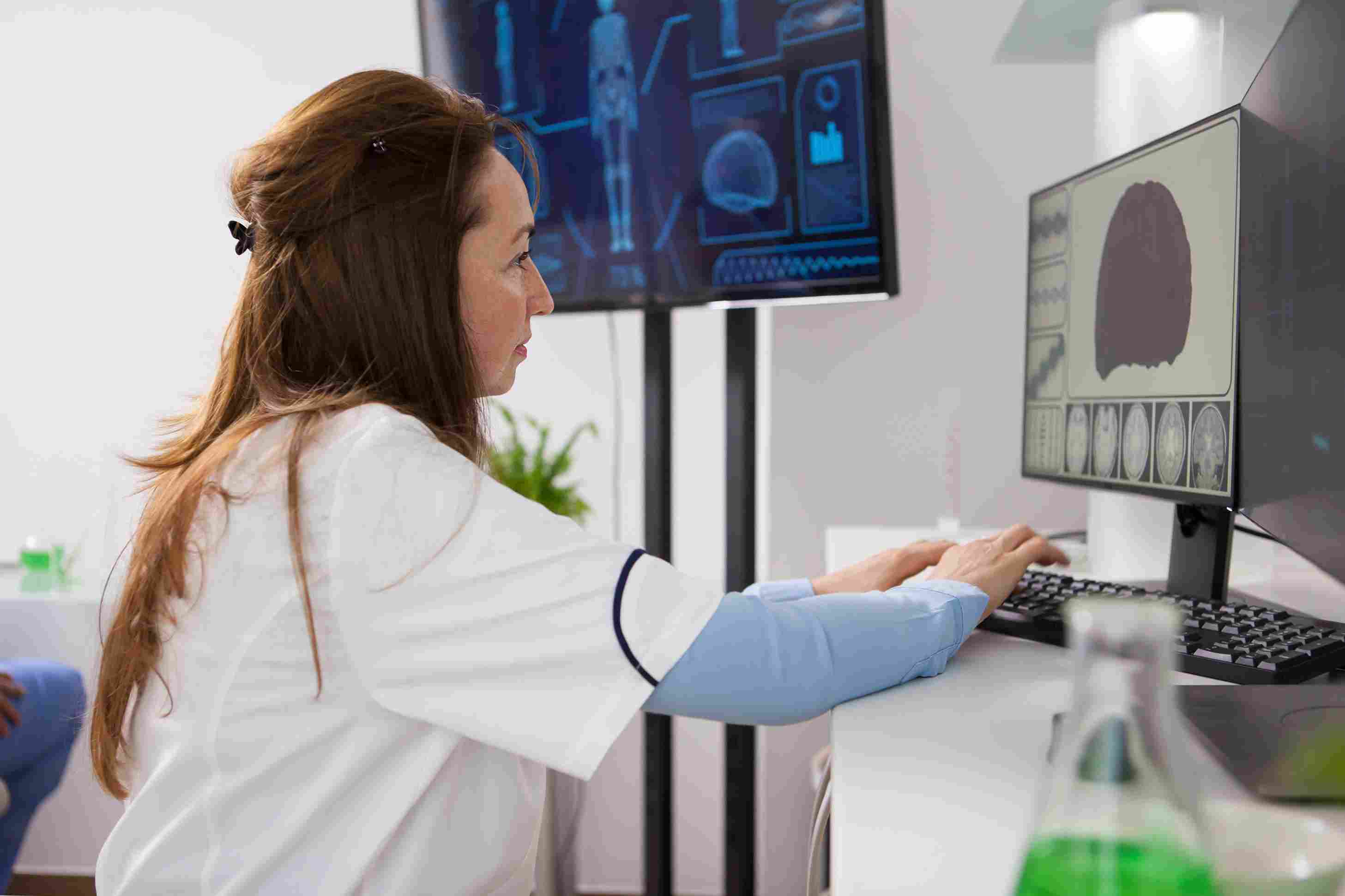 Biologist using secure computer systems to protect research and patient health data