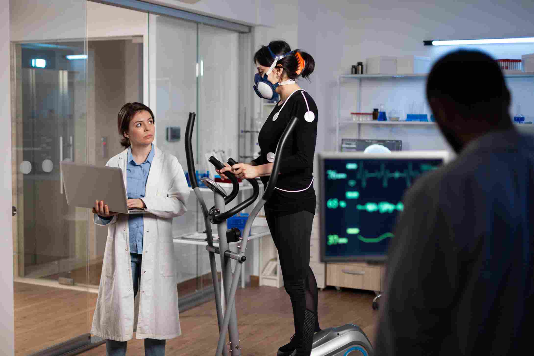 Researcher monitoring athlete’s medical data with advanced access control systems